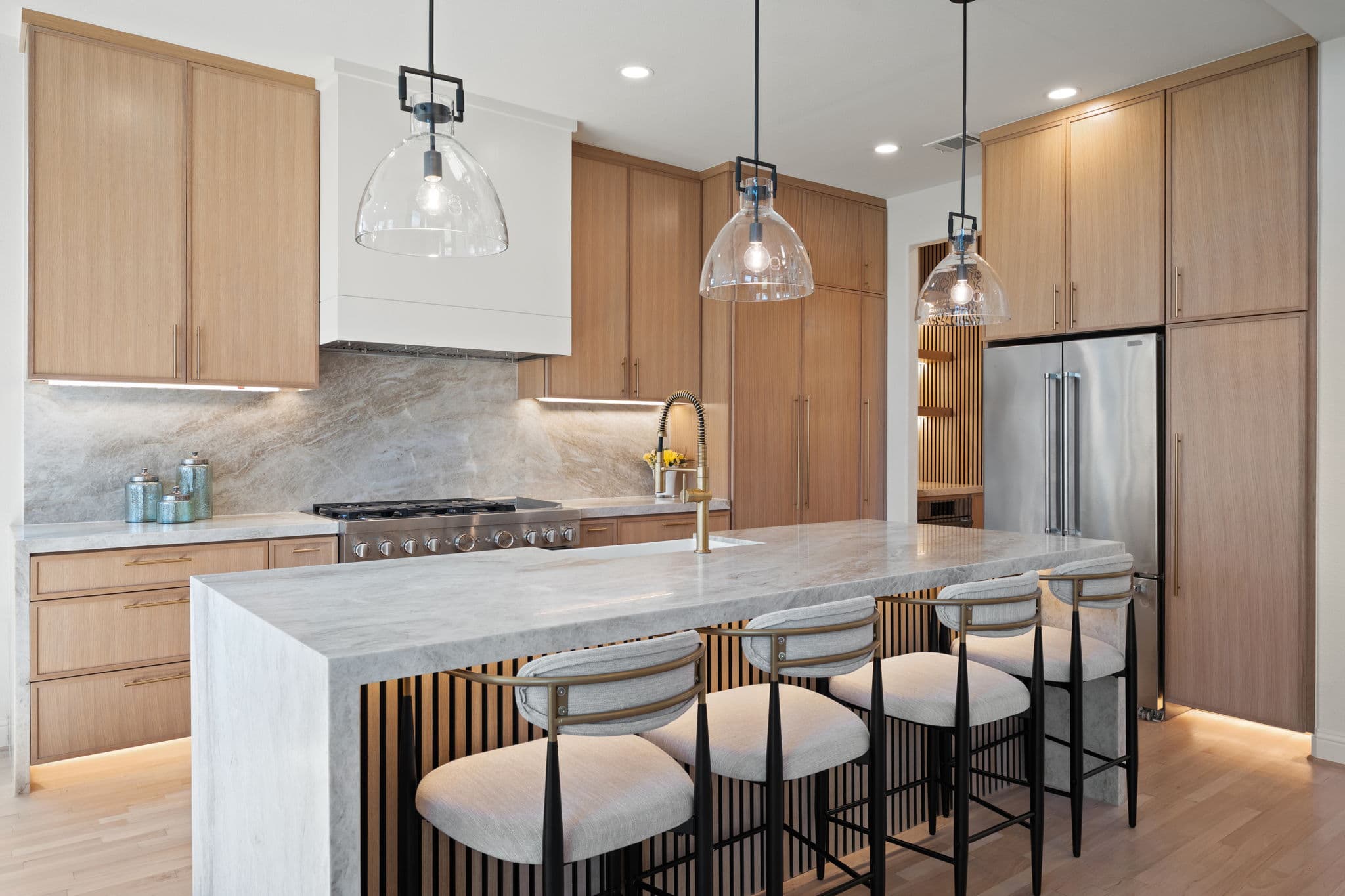 After: kitchen island with leathered Taj Mahal quartzite countertops, Trophy Club