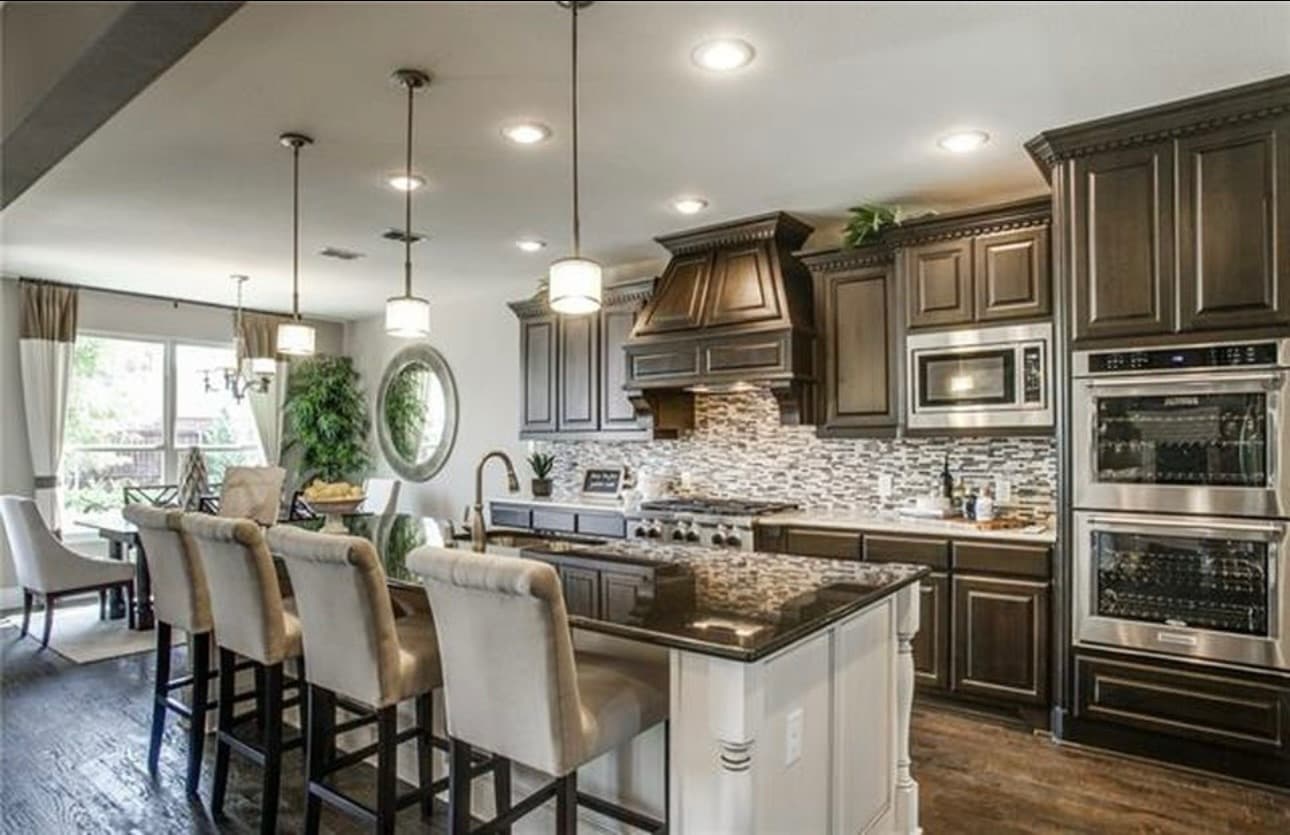 Before: dark wood range hood and cabinetry, Southlake kitchen